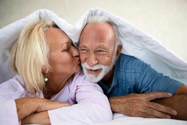 Loving senior couple in bed